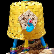 Load image into Gallery viewer, Colorful bird toy with a beak tempting 2-1/2" by 3" bamboo basket adorned with mahogany chunks and mahogany pods dangling underneath. The pods are strung on jute cord covered in paper straws with acrylic rings and mini atom beads.