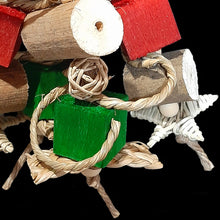 Load image into Gallery viewer, This Christmas bird toy is yucca with balsa cubes, sola chunks, vine stars, munch balls, seagrass cord, braided seagrass strips and little wood snap beads.