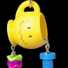 Load image into Gallery viewer, A super cute toy made with a mini acrylic mug, nickel plated bells, wiggle rings, beads and a mini nut-n-bolt set. The chain can be tugged back and forth for interactive play. For foraging fun, stuff a few nuts or pellets inside the mug.
*Available in assorted color combinations (yellow, red, green or blue mug).