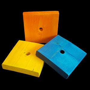 Brightly colored softwood (pine) blocks measuring 3-1/2" by 3-1/2" by 5/8" thick with a 1/2" center hole. Recommended for medium to large birds or as a toy base.