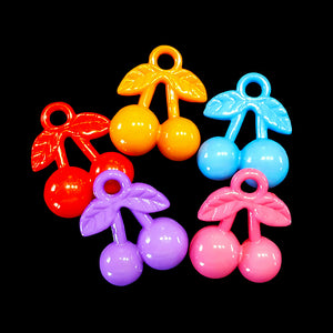 Acrylic cherry charms measuring approx 3/4" by 1" with a 3.5mm (approx 1/8") hole.  Package contains 10 charms in assorted colors.