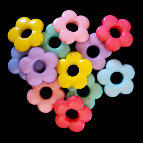Pastel colored acrylic rings in the shape of a daisy measuring approx 13/16