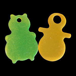 Thick acrylic toy tags in assorted colors and shapes measuring approx 2" with a hole on the top. Can also be drilled with smaller holes to make a toy base for small toys.