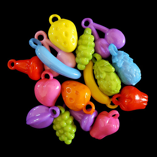 A mixture of small acrylic charms in little fruit shapes (apple, banana, cherry, pineapple, etc). Charms vary in size from 3/4