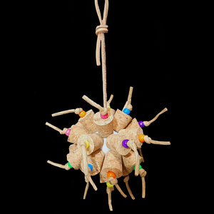 Two dozen cork stoppers with pony beads tied onto a perforated golf ball base with twisted paper cord. The toy hangs from a strip of veggie tanned leather lace. Designed for intermediate sized birds such as small conures, cockatiels, quakers, ringnecks, etc. up to slightly bigger birds that like softer textured toys. Measures approx 5" by 10" including link.
