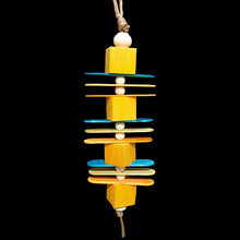 Load image into Gallery viewer, Four 1&quot; by 1&quot; x 1&quot; brightly colored balsa blocks with thin wood paddles and wood beads threaded on paper cord. Designed for light chewers.
