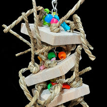 Load image into Gallery viewer, A perfect combination of balsa and seagrass! Four 2&quot; by 2&quot; balsa slices with crunchy seagrass cord knotted through the corners. Colorful charms and pony beads are interspersed between the balsa on nickel plated chain. Hangs approx 9&quot; including link.

