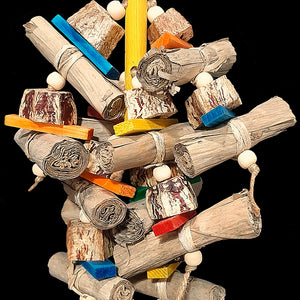 An exciting combination of easy to chew and shred banana leaf rolls, mahogany pod chunks, brightly colored mini softwood slats and small wood beads strung on jute cord from a wood base. Designed for small up to medium sized birds who love softer textures.