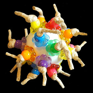 Lots of brightly colored pony beads & crystal stringing rings knotted onto a plastic golf ball with jute cord.  Designed as a foot toy for medium to large birds or as a cage top toy for the smaller guys.