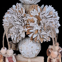 Load image into Gallery viewer, Shreddable bird toy with large sola wood flowers, sola balls, mahogany pods, banana leaf roll, palm and wood beads. For parrots that love soft textures.

