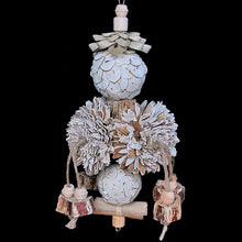 Load image into Gallery viewer, An exciting shreddable bird toy made on stainless steel wire with four large sola flowers on a palm leaf cube along with two sola balls. For added texture we've added a crunchy palm leaf bow at the top, a banana leaf roll on the bottom and adorned it with mahogany pod chunks with natural wood beads on jute cord. Designed for small to mid size birds that love softer textures.
