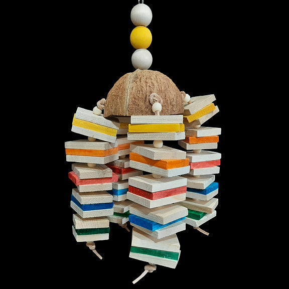 Sixty natural and colored pine wood slats with small wood snap beads strung on veggie tanned leather lace from a coconut shell half. The coconut shell hangs from nickel plated chain with hardwood balls on the top.