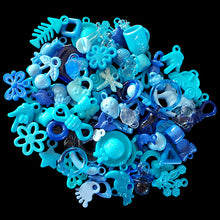 Load image into Gallery viewer, One half pound of mixed acrylic charms in assorted shapes and sizes. Mixture will consist of what we have in stock, so no two bags will be alike. Includes both solid and transparent (crystal) colors and many styles not shown on our website.
