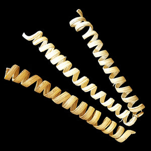 A spiral of natural cane measuring approx 1/2" by 5". Great for toy making or use a foot toy. These are natural parts, so the size may vary slightly.