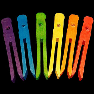 Brightly colored wood clothes pins measuring approx 3-3/4" long with a 1/4" hole drilled near the top.