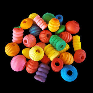 An assortment of brightly colored wood beads in different shapes. Sizes depend on the shape, but average approx 3/4" with a hole that works with leather lace, paulie rope and cotton cord. Recommended for small and intermediate birds.