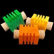 Load image into Gallery viewer, Brightly colored grooved pine &quot;Busy Beaver Blocks&quot; with cork stoppers on the ends. Designed for medium to large birds. Each toy measures approx 1-1/2&quot; by 2-3/4&quot;.
