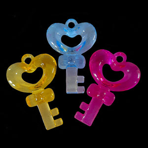 Large crystal colored key charms measuring approx 1-1/4" at the top by 1-7/8" in length with a 3mm (approx 1/8") stringing hole.  Package contains 10 charms in assorted transparent colors.