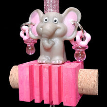 Load image into Gallery viewer, This little elephant girl is sitting pretty with pony beads, mini pacifiers &amp; wiggle rings on a notched pine block with corks on the sides and a shiny bell on the bottom. Built on stainless steel wire with nickel plated hardware.
Hangs approx 7-1/2&quot; including link.
