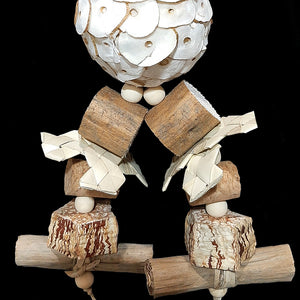 A multi-textured shredding toy made with an assortment of natural, easy to chew and destroy parts! The base is a super soft sola ball with mahogany chunks, cork stoppers, sola wood rounds, palm leaf shredders, banana leaf rolls and small wood snap beads. Designed for small birds who love soft textures and baby birds learning how to play.