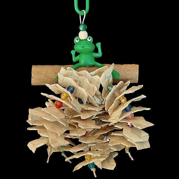 A rubber frog sitting atop a sola log with strands of hemp cord threaded with lots of crunchy palm leaf zigzag shredders and shiny beads. Designed for small birds that like to shred.  Measures approx 4-1/2