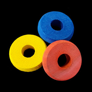 Brightly colored wood rings measuring approx 1-1/4" by 3/8" thick with a 7/16" hole.