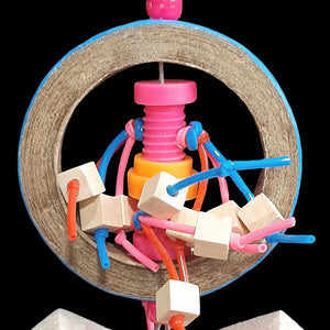 Lots of little wood cube beads on plastic lacing cord streaming out of a mini nut-n-bolt set inside a birdie bagel. Strung on stainless steel wire with pony beads and balsa blocks. Designed for small to intermediate sized birds that like smaller toys.
