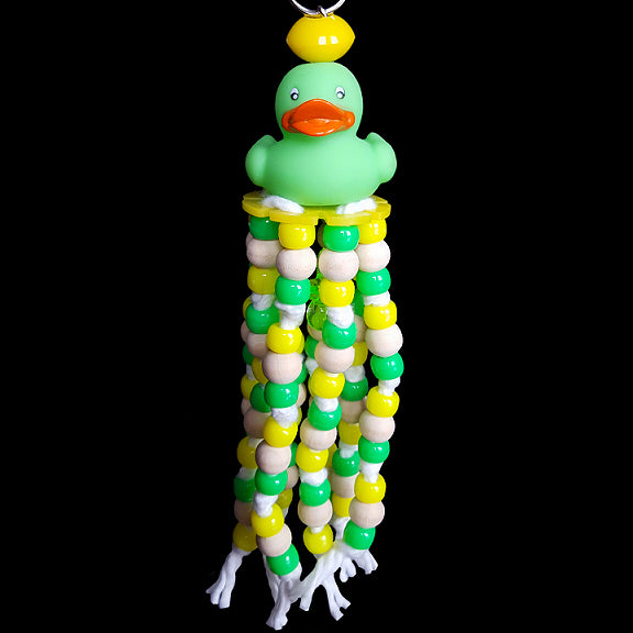 A combination of pony beads and little wood snap beads knotted on cotton cord under a little rubber duck with a charm hidden inside. Available in assorted color combinations