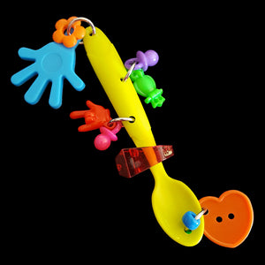 A plastic spoon full of charms and trinkets. Designed for medium to large birds. Great for messy birds as it can be washed. Can also be used as a hanging toy for smaller birds.  Measures approx 5-1/2".