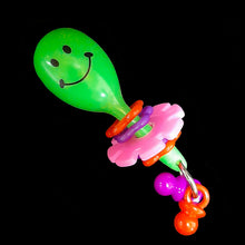 Load image into Gallery viewer, A light weight foot toy made with a mini plastic maraca with pacifier dangles, flower rings and a spinning daisy wheel. Designed for small to intermediate sized birds who are gentle with their toys. Available in assorted color combinations.  Measures approx 1-1/4&quot; by 3-1/2&quot;.
