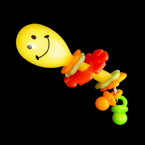 A light weight foot toy made with a mini plastic maraca with pacifier dangles, flower rings and a spinning daisy wheel. Designed for small to intermediate sized birds who are gentle with their toys. Available in assorted color combinations.  Measures approx 1-1/4
