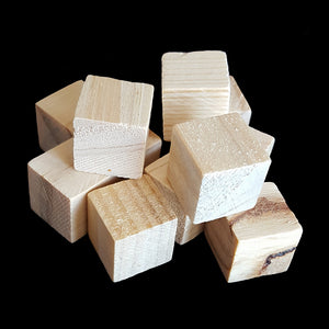 Small, uncolored hard wood cubes measuring approx 5/8" with no hole.
