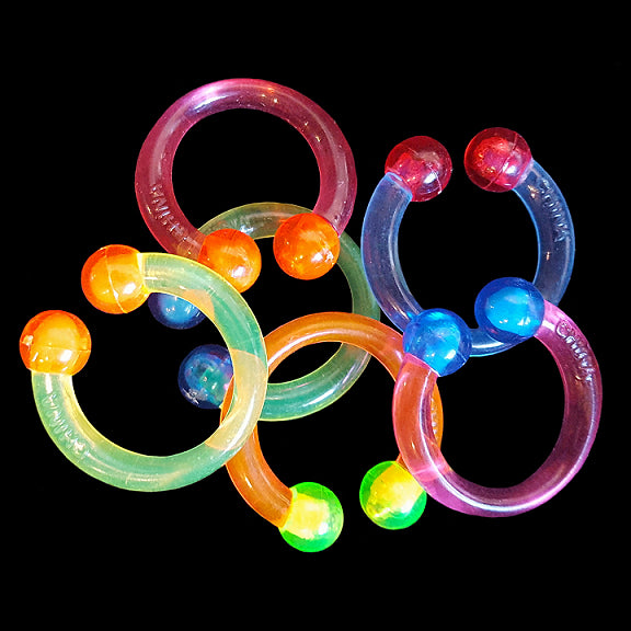 Crystal colored hard plastic rings just under 1