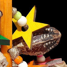 Load image into Gallery viewer, A dozen mahogany pods with brightly colored pine wood stars and small beads strung on jute cord from a pine dowel toy base.
