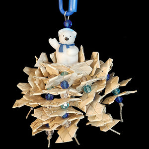Six strands of zigzag palm leaf shredders & crystal beads hanging under a little rubber polar bear. Strung on hemp cord. Designed for small birds such as budgies, lovebirds, parrotlets, canaries, etc. Available in assorted color combinations (red, green, blue, white).  Hangs approx 7" including link.