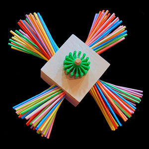 A chunky 3" by 3" natural wood block filled with lots of brightly colored paper lollipop sticks to chew and peel along with a spinning plastic gear. This is a side-mount toy that attaches to the side of your bird's cage. Suitable for birds of all sizes.  Measures approx 3" by 9" by 9".