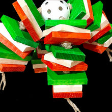 Load image into Gallery viewer, Christmas bird toy with pine slats on jute cord on a perforated golf ball with a cute Christmas penguin seated on the top.
