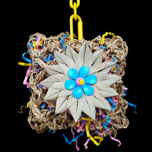 Lots of foraging adventure in this toy! A seagrass pouch filled with crinkle cut paper & decorated with a crunchy palm leaf flower. Stuff extra treats inside and watch the fun begin! Designed for all birds.