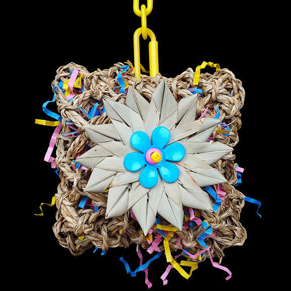 Lots of foraging adventure in this toy! A seagrass pouch filled with crinkle cut paper & decorated with a crunchy palm leaf flower. Stuff extra treats inside and watch the fun begin! Designed for all birds.