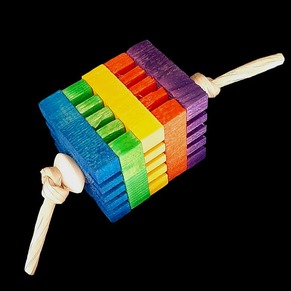 Brightly colored notched pine slices piled together with paper rope and wood beads. Designed for intermediate to mid sized birds as well as bunnies and other critters that need to chew.  Measures approx 1-1/2