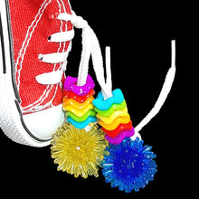 Load image into Gallery viewer, A miniature canvas sneaker decorated with brightly colored wiggle rings, mini spike balls and a charm. Makes a great foraging toy - simply hide a treat or two inside for foraging fun! Note: Sneaker does not have metal grommets like some do! Comes in assorted colors.  Hangs approx 6&quot; including link.
