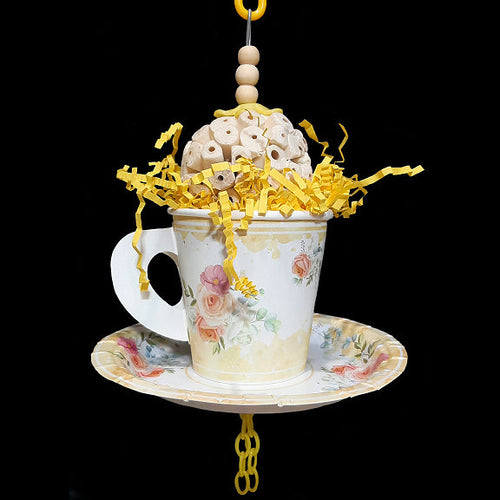Your bird is sure to have a party with this super-soft sola ball nestled inside a paper tea cup and saucer! The cup is stuffed with crinkle paper shred and has a cork stopper hidden inside. Strung on stainless steel wire with small wood snap beads and pla