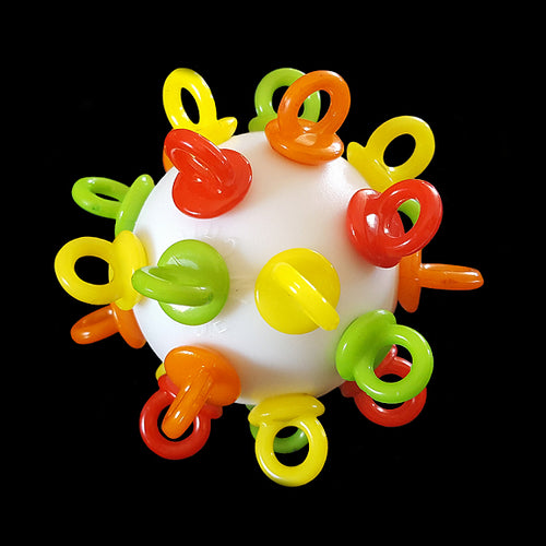A perforated golf ball loaded with mini pacifiers & beads inside that rattle. This foot toy is great for intermediate to medium sized birds and can be easily washed by hand or in the dishwasher.  Measures approx 2-1/2