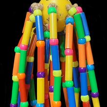 Load image into Gallery viewer, Colorful parrot toy with plastic straw beads and bright pony beads tied with jute cord on a perforated plastic golf ball.
