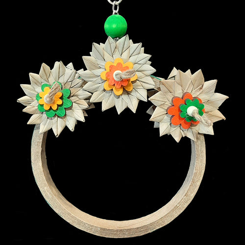 An adorable swing that doubles as a shreddable toy! Made on a large birdie bagel with six crunchy palm leaf flowers (three on each side) and brightly colored pine daisies and wood snap beads on jute cord. Designed for intermediate sized birds such as senegals, caiques, ringnecks, quakers or even a couple smaller birds.