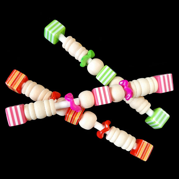 Light-weight foot toys made for the little guys with wood beads, wiggle rings and acrylic allsort beads on a rolled paper lollipop stick. Designed for small conures, cockatiels, quaker parakeets and other like-sized birds that enjoy handheld toys. Each toy measures approx 3-1/2