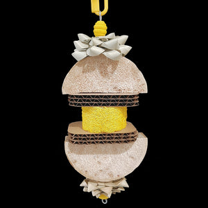 Created and named for a special little bird who loves softer textures! Made with yucca slices, cardboard cutouts, crunchy palm leaf bows and a colored loofah slice with wood beads threaded on stainless steel wire. Will be loved by small to intermediate sized birds who like softer materials.  Measures approx 3-1/2" by 10" including link.