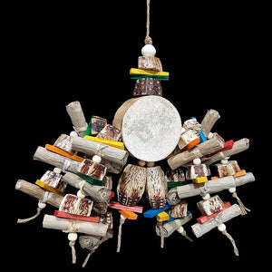 Your bird will think it's hit the jackpot with this toy! The base is a 3 - 3-1/2" yucca round with six arms of banana leaf rolls, mahogany chunks, brightly colored mini pine wood slats and wood snap beads strung on jute cord. At the bottom are two large mahogany pods with more pine slats and snap beads.