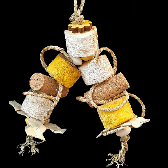For birds who love soft textures! An irresistible, beak tempting combination of yucca wood, cork stoppers, palm leaf shredders, seagrass rope, wood beads and a pine daisy. Designed for small birds or intermediate birds that aren't big chewers. *Now made on paulie rope for longer lasting durability.  Measures approx 4
